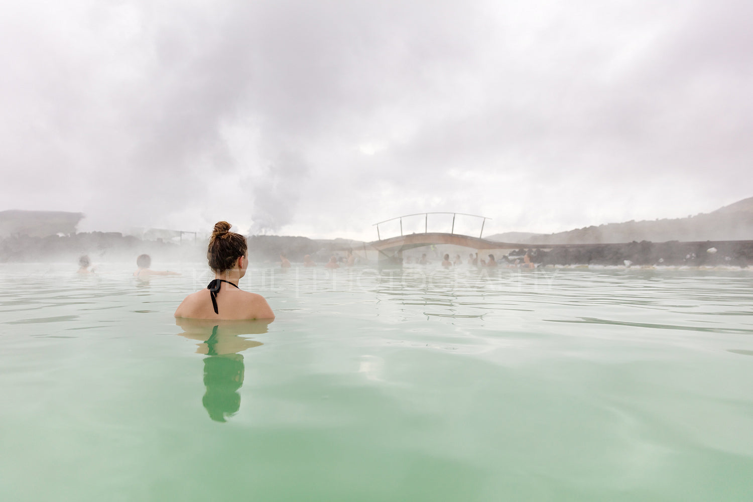 Woman taking a relaxing bath while relaxing in hot spring
