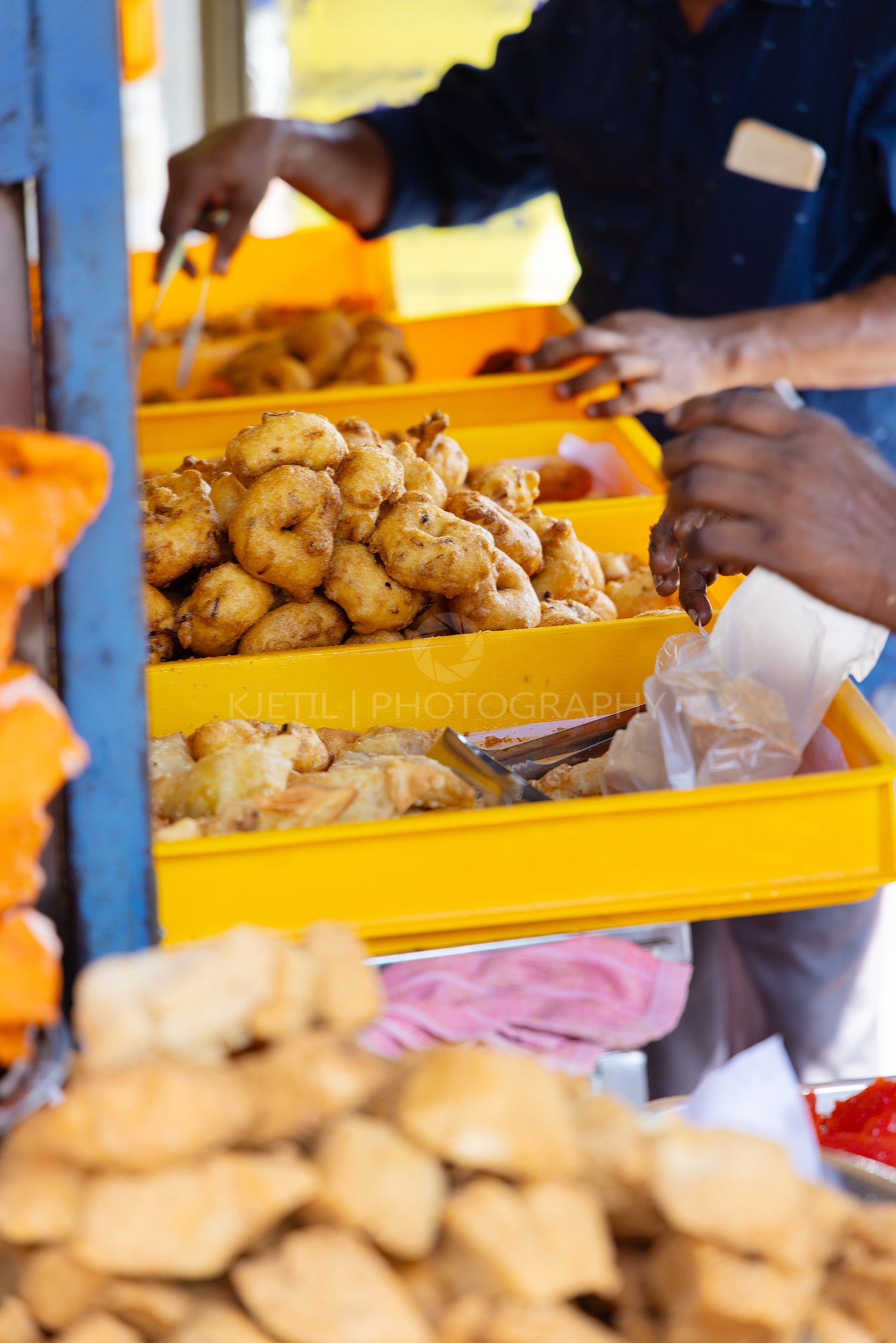 Street food vendor selling fried snacks in Asia