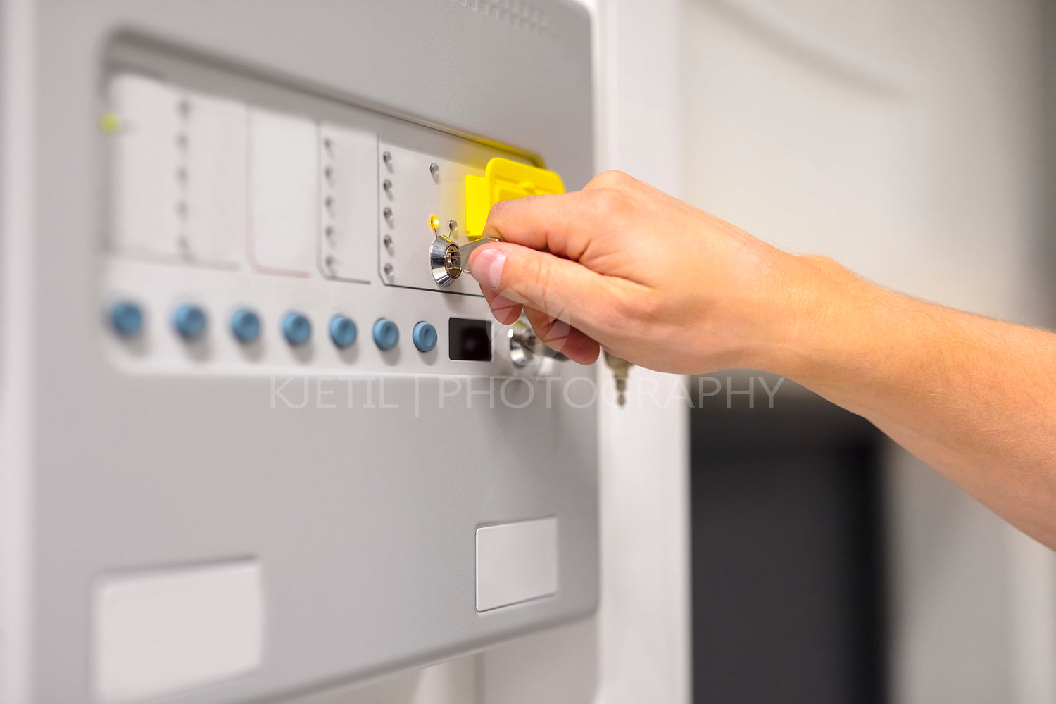 IT Engineer Using Key To Open Fire Panel In Datacenter