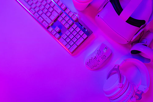 Keyboard with mouse and headphones on gaming desk