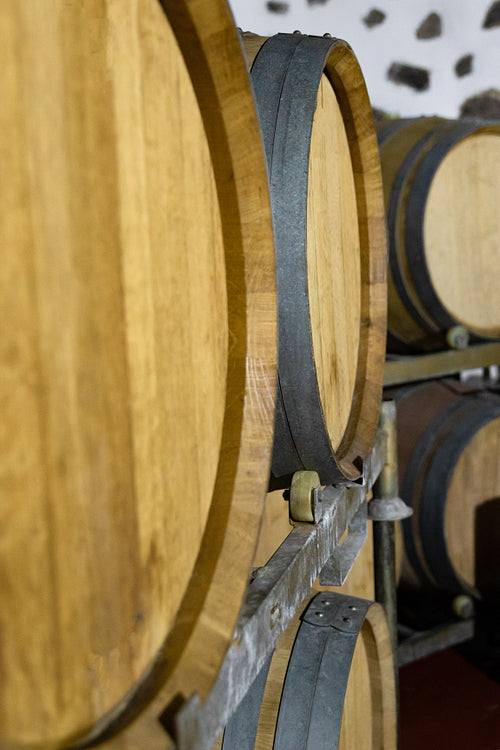 Close-up of Wooden Barrels in oak Stored At Wine Cellar