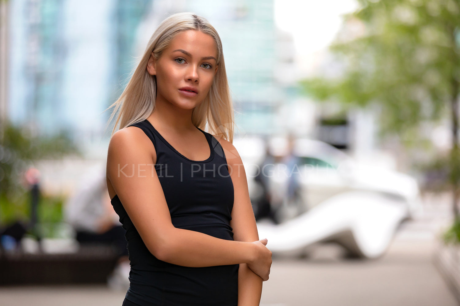 Portrait of a blonde young woman fitness model looking at camera