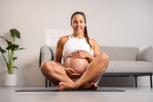 Smiling Pregnant Woman Sitting at Home, Doing Pilates and Yoga Workout