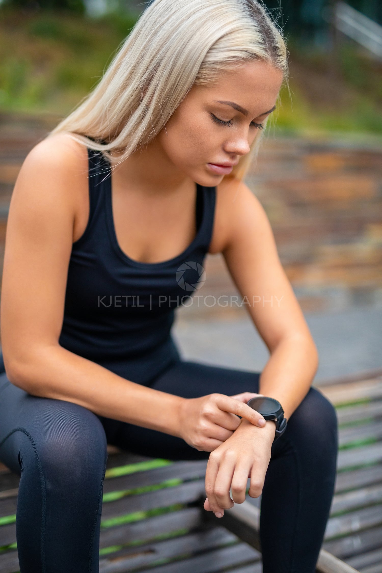 Woman Taking A Break After Workout And Checking Time On Smartwatch