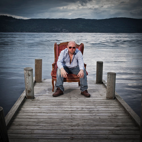 Man in Chair on a Pier