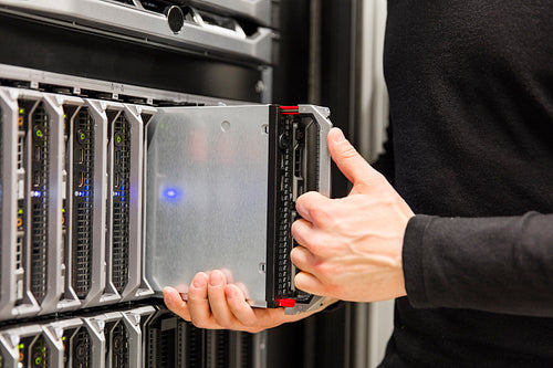 IT consultant install blade server in large datacenter