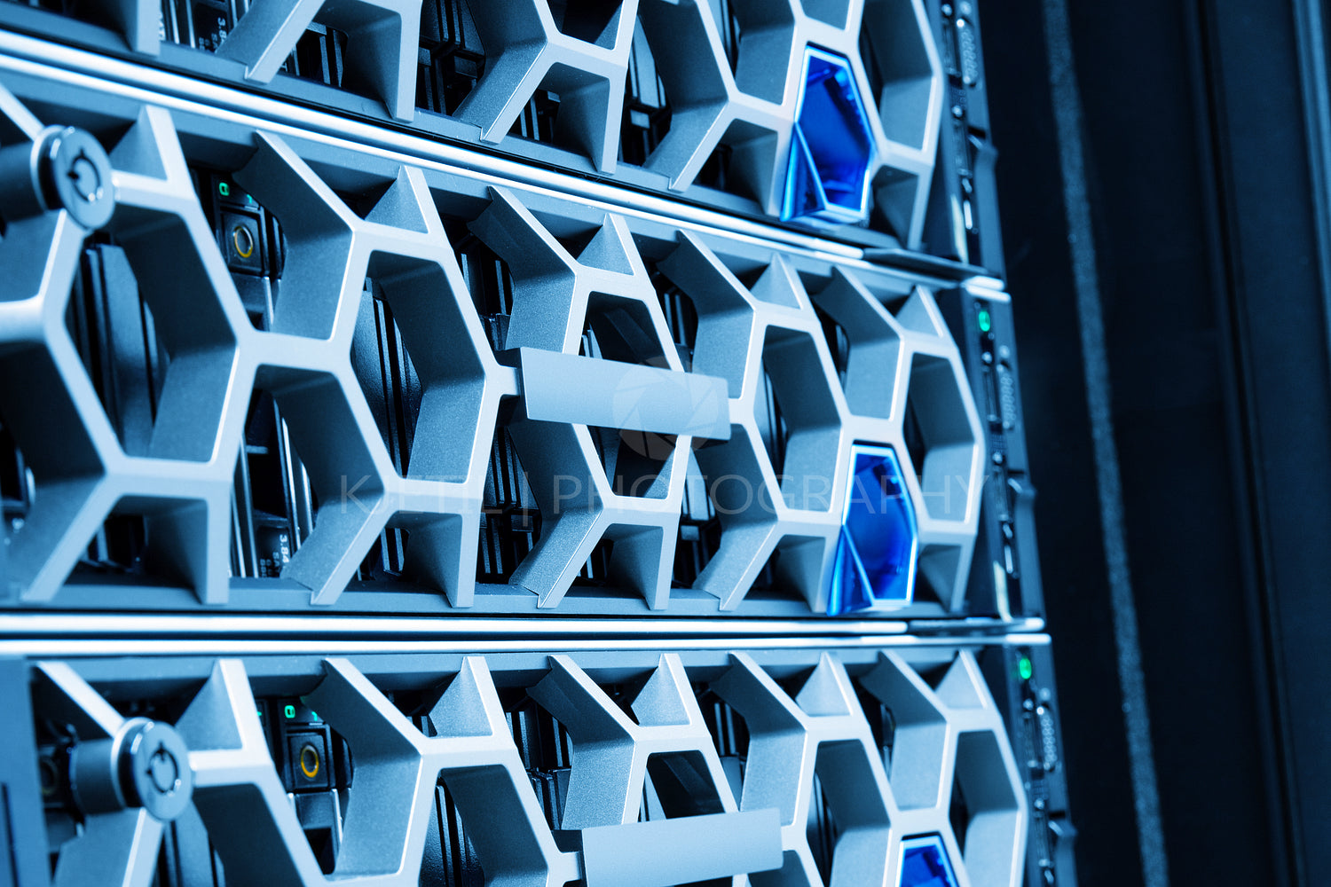 Closeup Of Modern Hard Drives In Illuminated Blue Datacenter