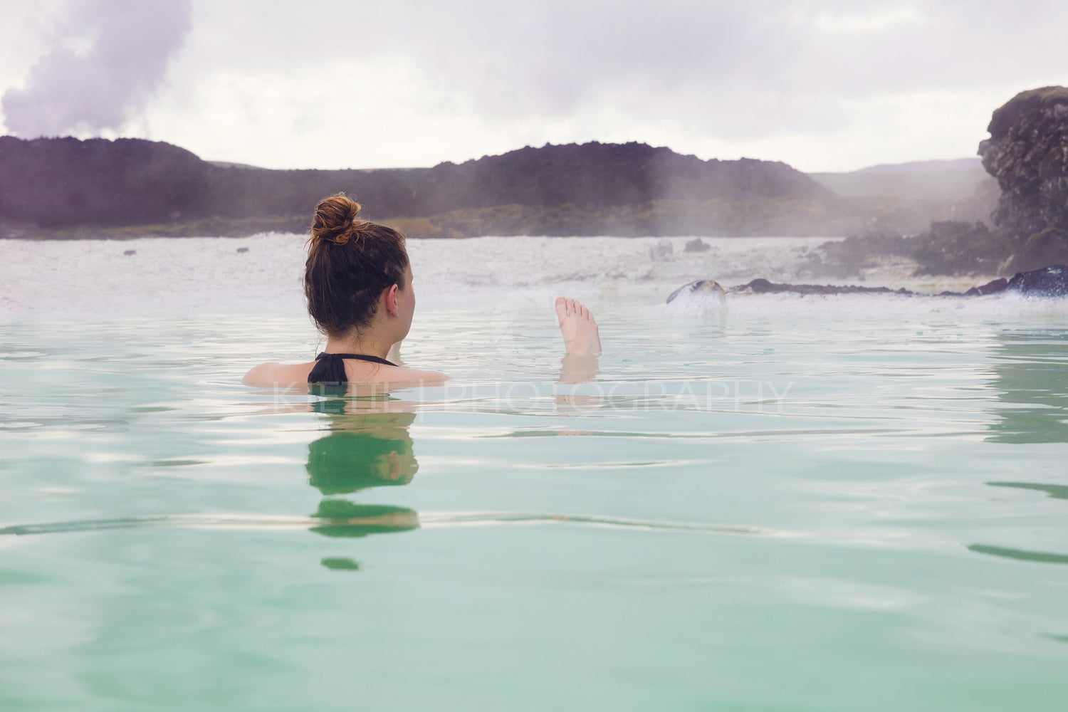 Woman Relaxing In Hot Spring Outdoor At Iceland