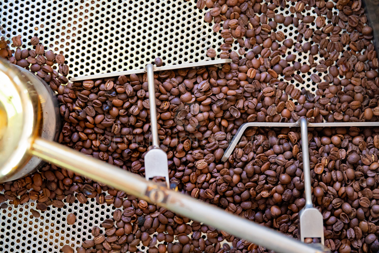 Top view of Raw Coffee Beans In Roaster Machine