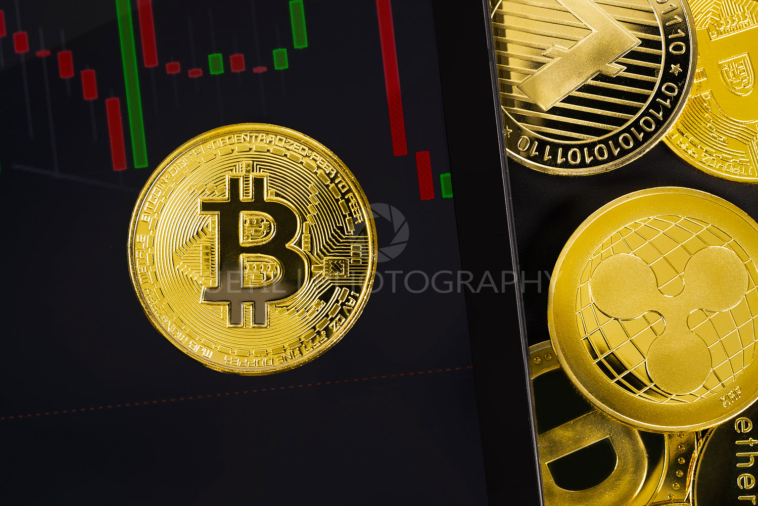 Close-up of Bitcoin on digital tablet with graph by various coins