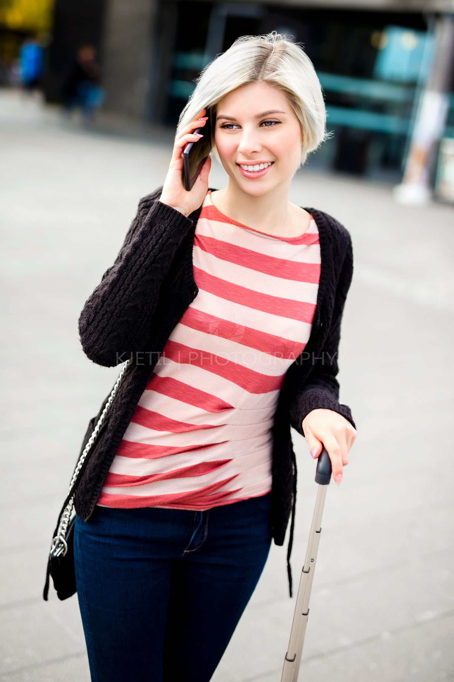 Smiling Woman Talking On Smart Phone Outside Railroad Station