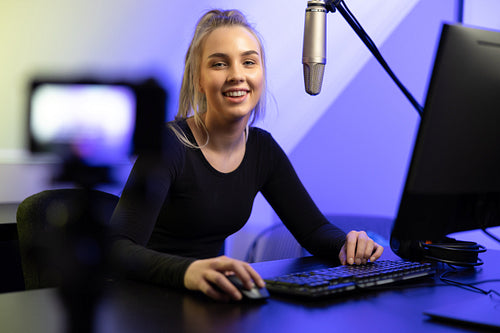 New Generation Female e-sport gamer streaming vlog online from office