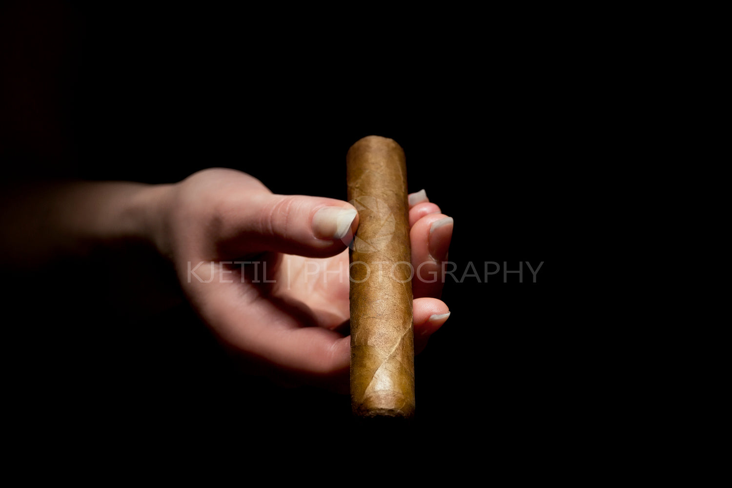 Woman Holding a Exclusive Cigar