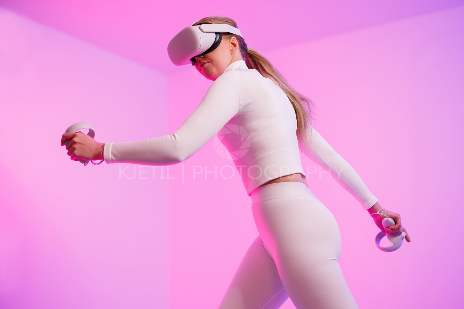 Female in VR glasses workout by illuminated background