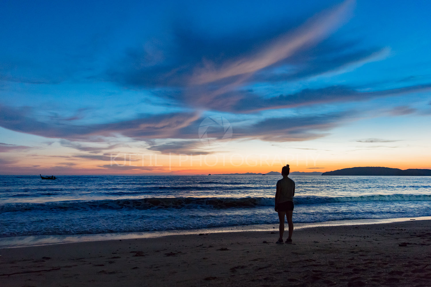 Silhouette Woman Standing At Beach During Sunset