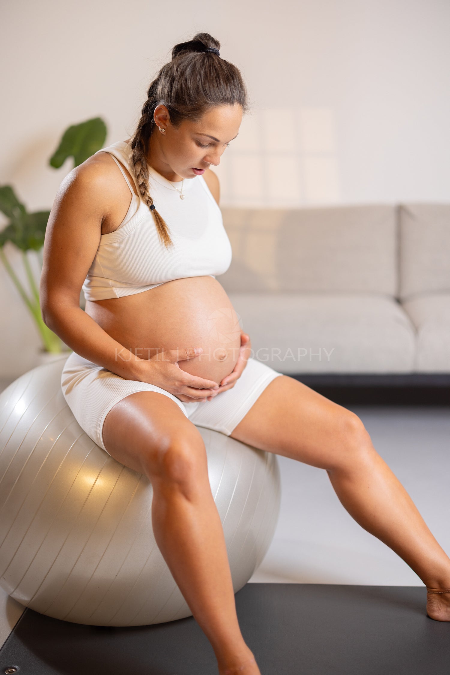 Expectant Mother Engages in Indoor Exercise at Home for Personal Wellbeing