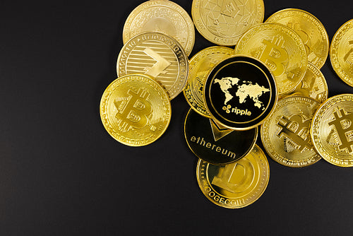 Ripple coin on top of various golden cryptocurrencies
