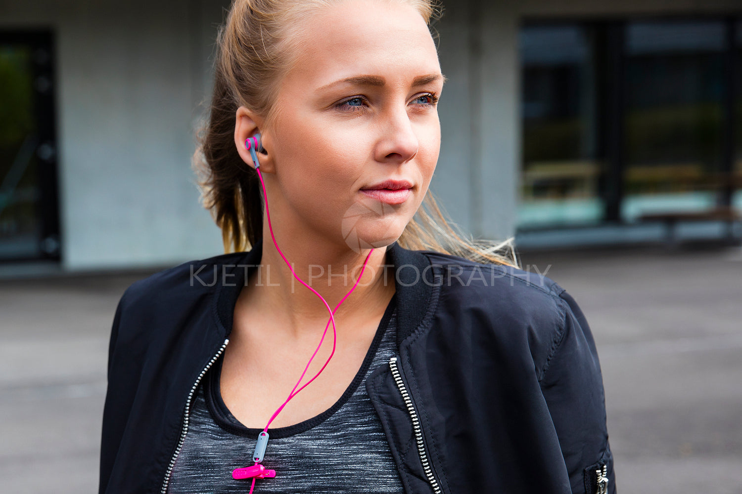 Thoughtful Young Woman In Sportswear Listening To Music