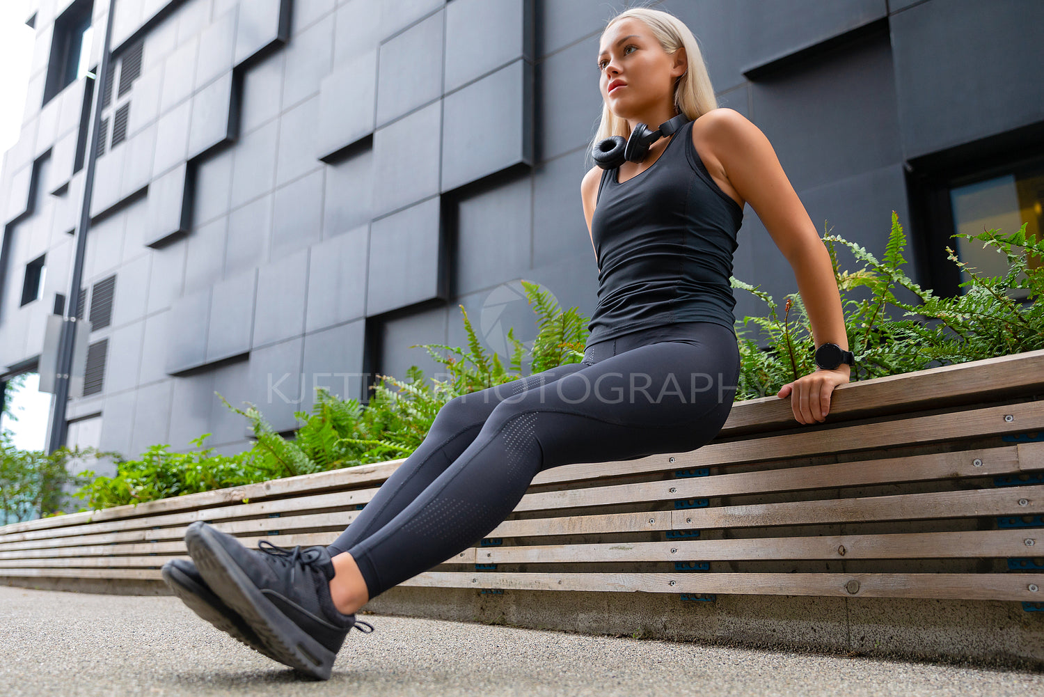 Fit Woman Doing Triceps Dips Outdoor in Modern City