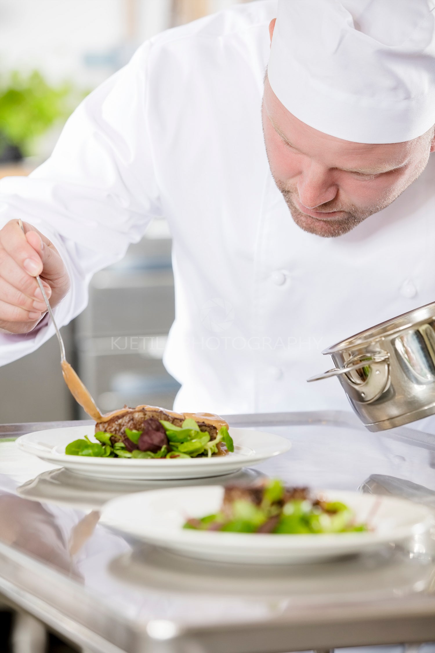 Professional chef prepare meat dish at restaurant