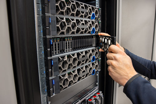 Hands Of Male Technical Consultant Working with Hyperconverged Environment Datacenter