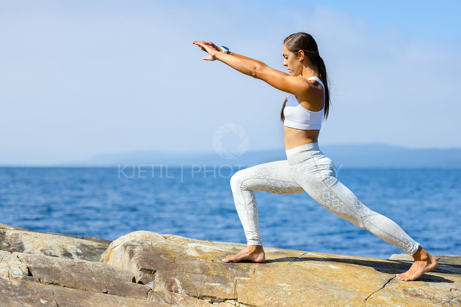 Female Athlete Practicing Yoga Streching Workout Outdoors by the Sea
