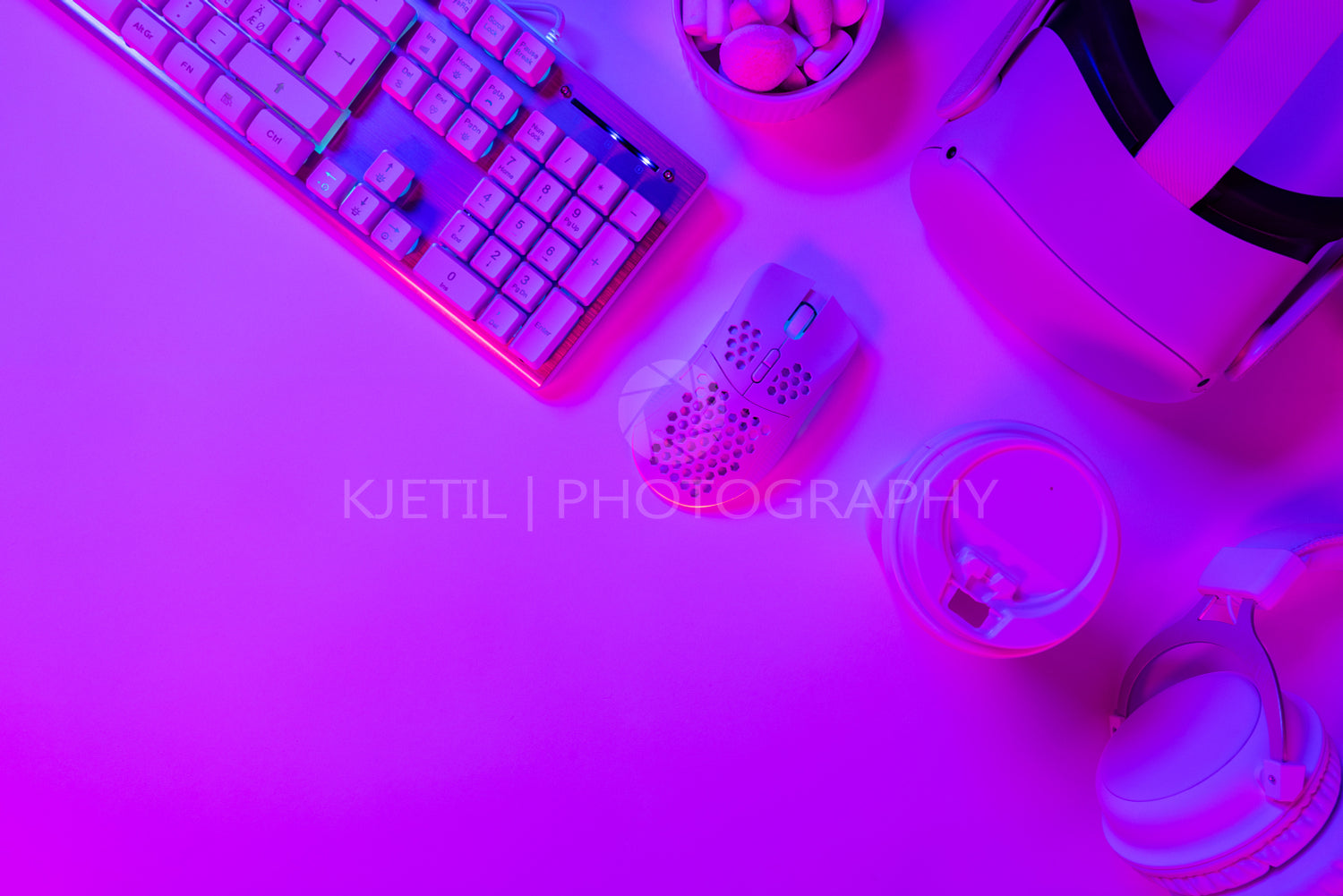 Keyboard with mouse and cup on gaming desk