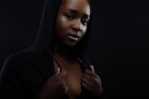 Confident and beautiful woman with dark skin and attitude wearing hoodie
