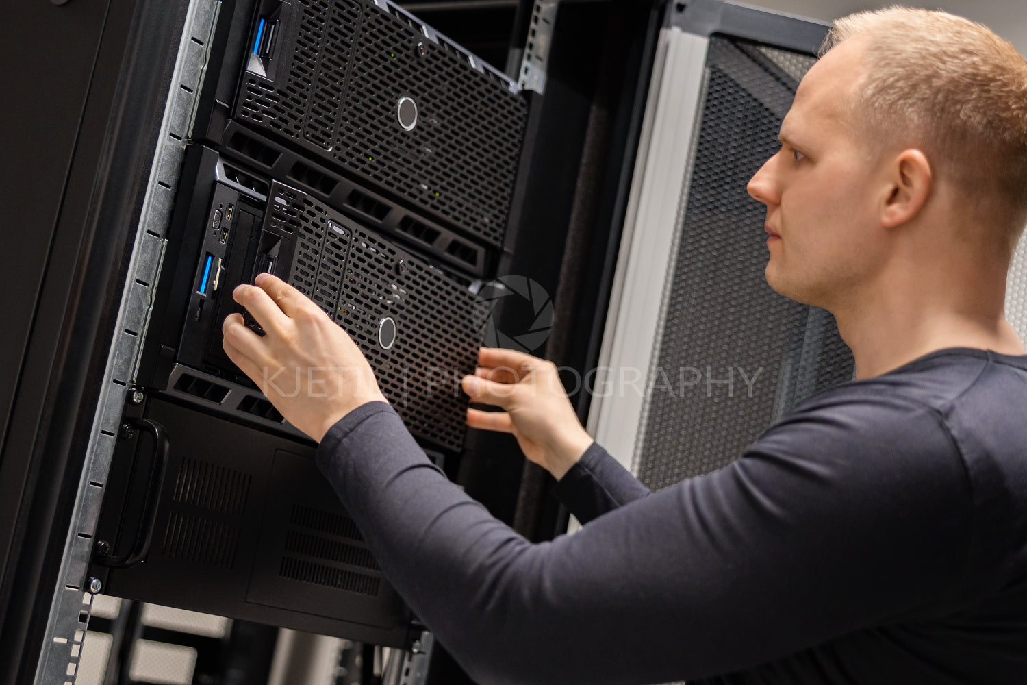 IT Consultant Installing Servers In Large Cloud Datacenter