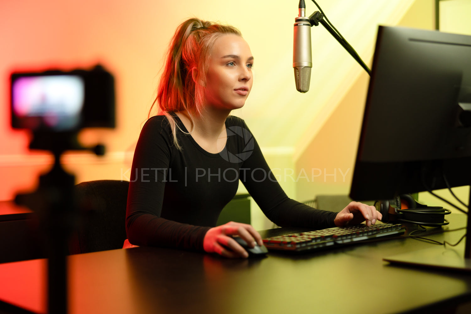 Professional e-sport gamer girl streaming and plays online video game on PC