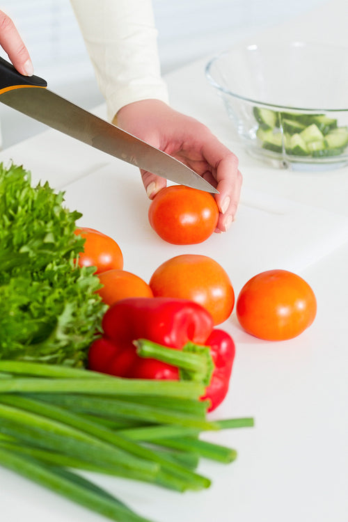 Chopping Tomato to a Healthy Salad