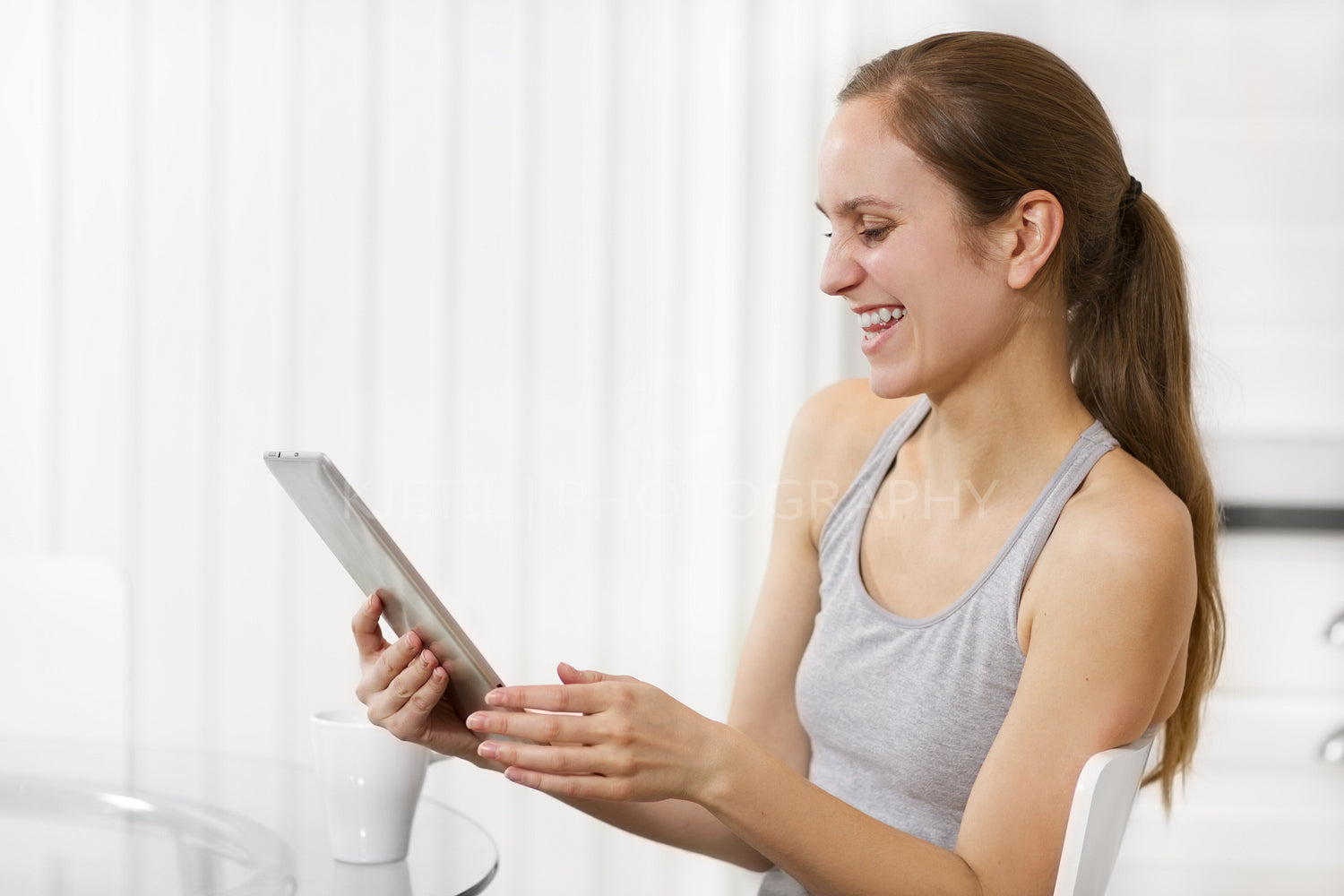 Girl laughing and user pad