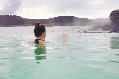 Woman Relaxing In Hot Spring Outdoor At Iceland