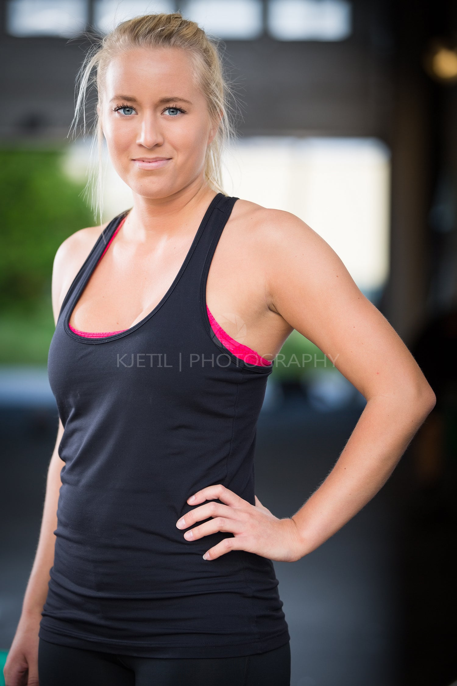 Young blonde woman in workout outfit