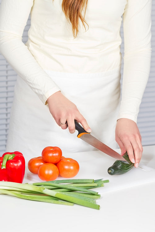 Young Woman Chopping Vegetables