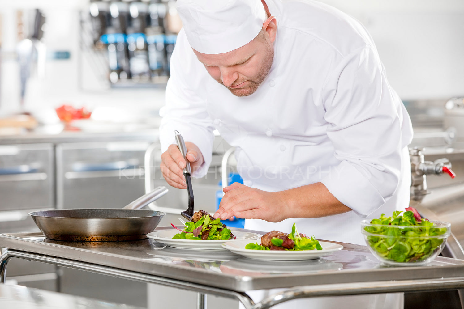 Professional chef prepare steak dish at restaurant