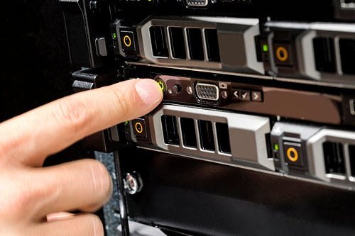 Engineer's Finger Switching On Server At Data Center