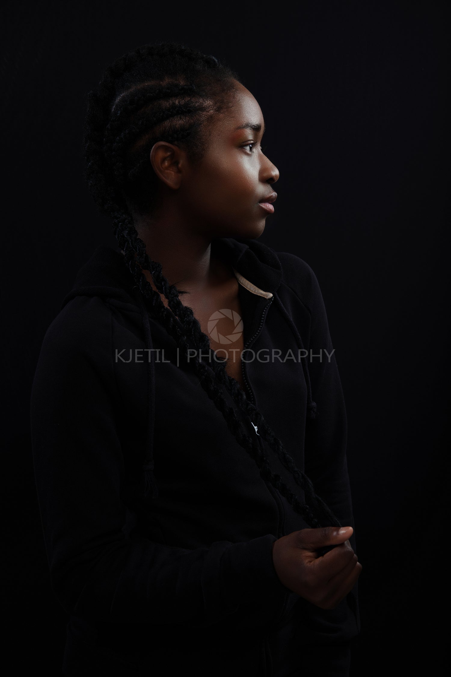 Confident woman with dark skin and cool attitude wearing hoody