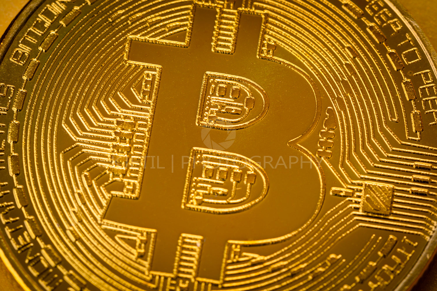 Top view closeup photo of one gold bitcoin