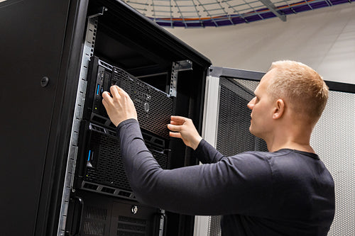 IT Engineer Working With Servers In Datacenter