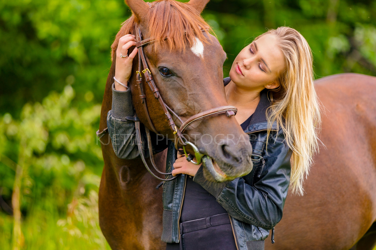 Beautiful woman communicate with her arabian horse in the field