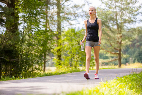 Woman walking outdoor in the forest as workout
