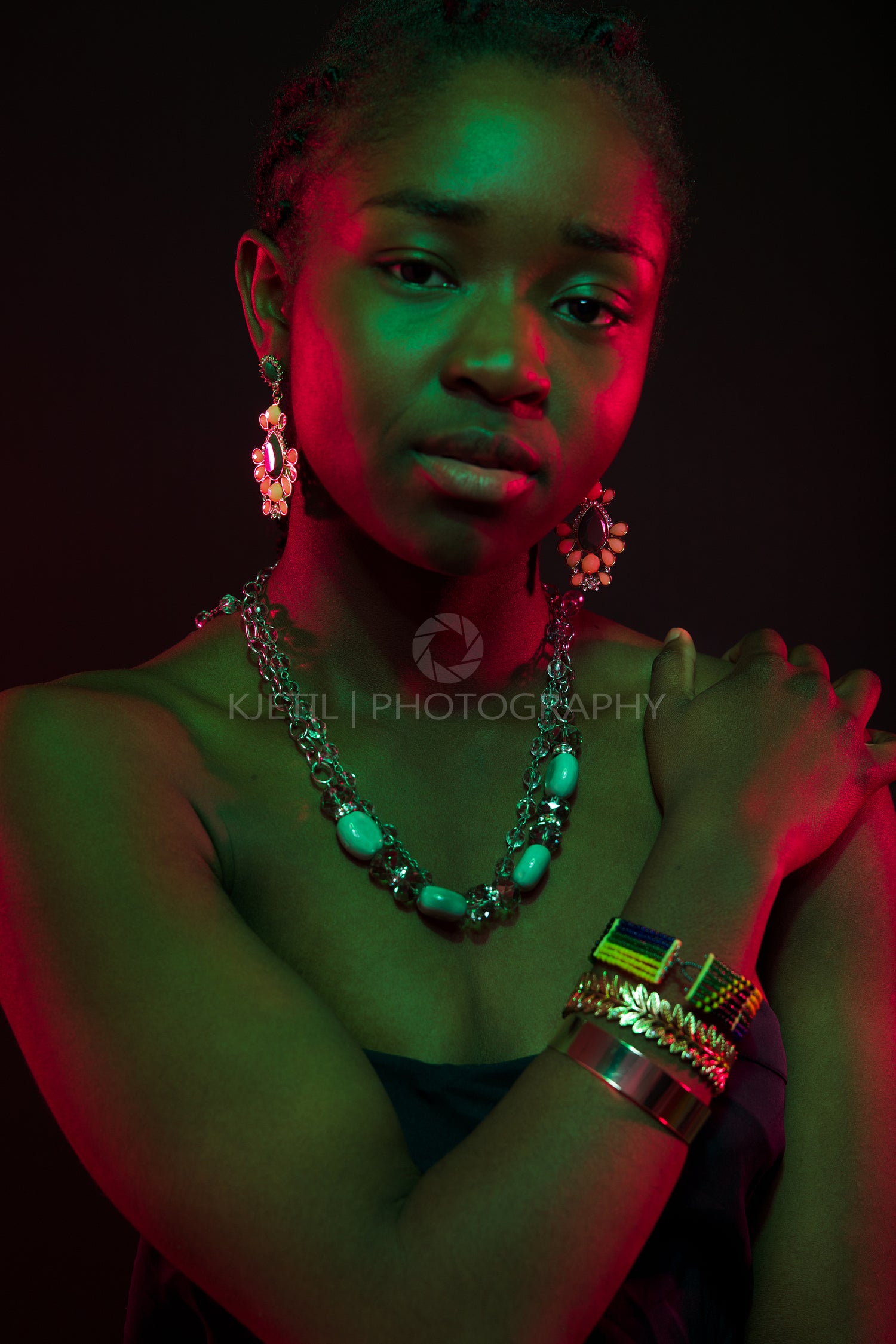 Confident Woman Wearing Jewelry Over Black Background