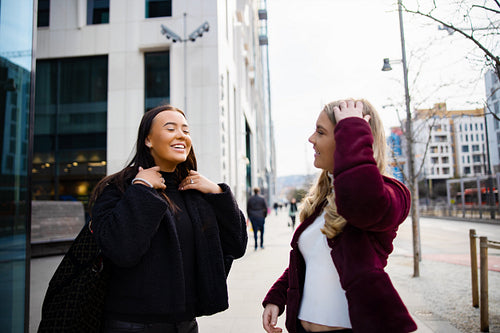 Two Female Friends Having Fun Laughing and Shopping in the City