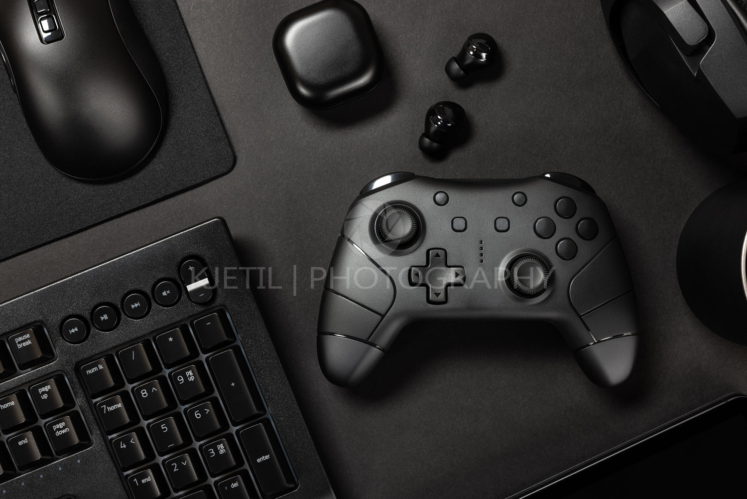 Gaming controller amidst various modern devices