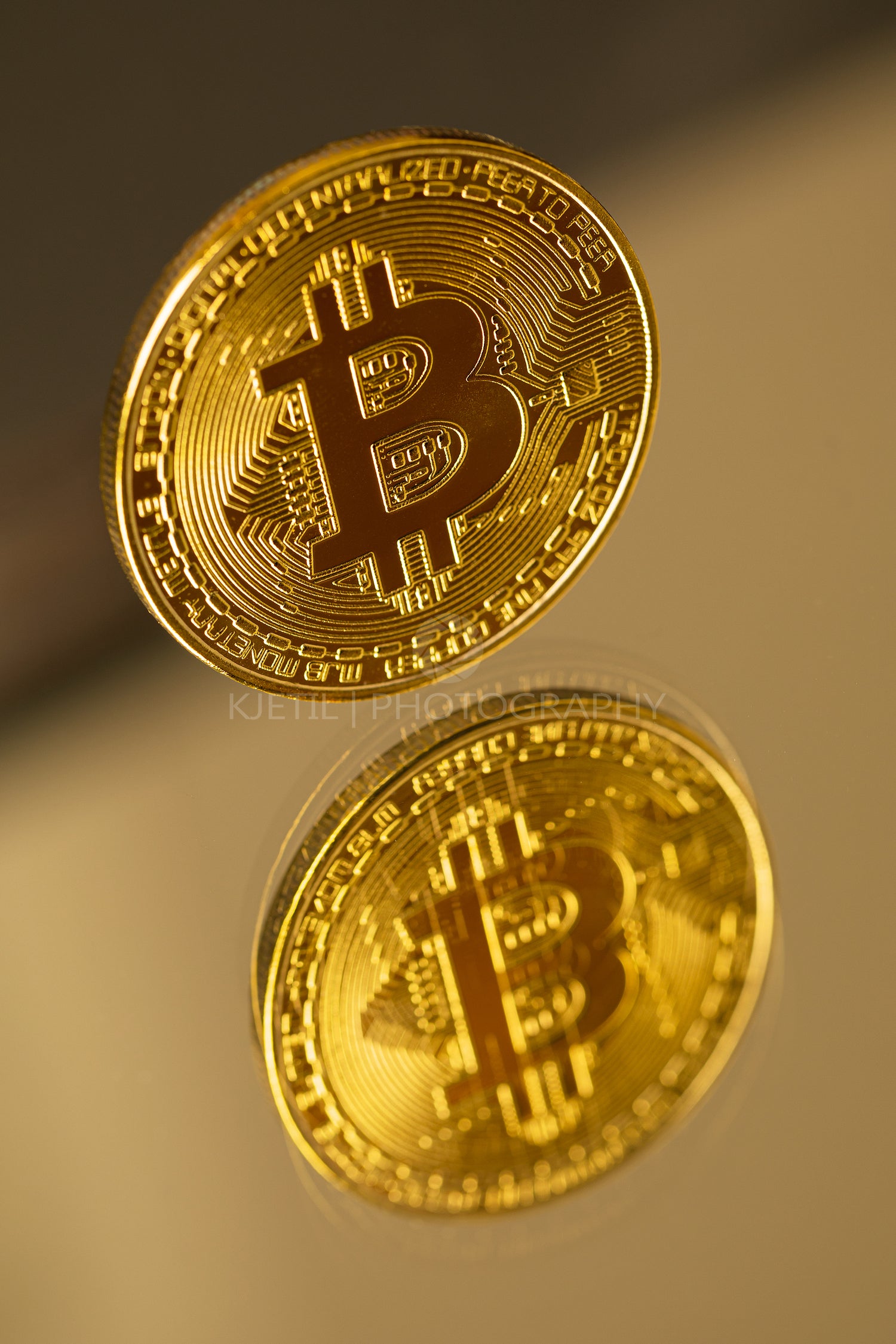 Gold Bitcoin Cryptocurrency Coin With Reflection On Mirror
