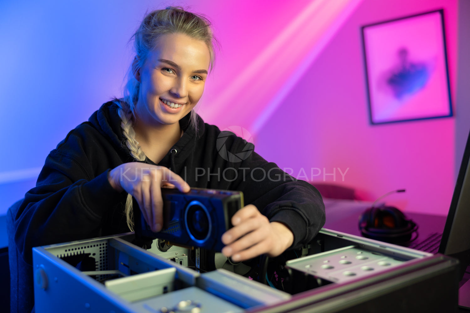 Smiling E-sport Gamer Girl Installing New GPU Video Card in Her Gaming PC