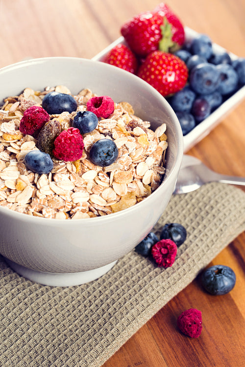 A bowl of muesli with fresh berries