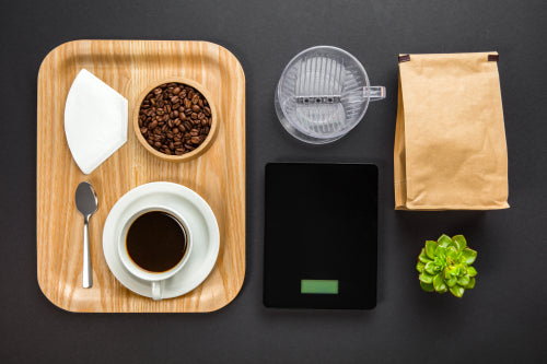 Overhead View Of Roasted Beans With Coffee Cup In Tray