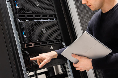 IT Support Holding Digital Tablet Examining and Perform Service on Servers
